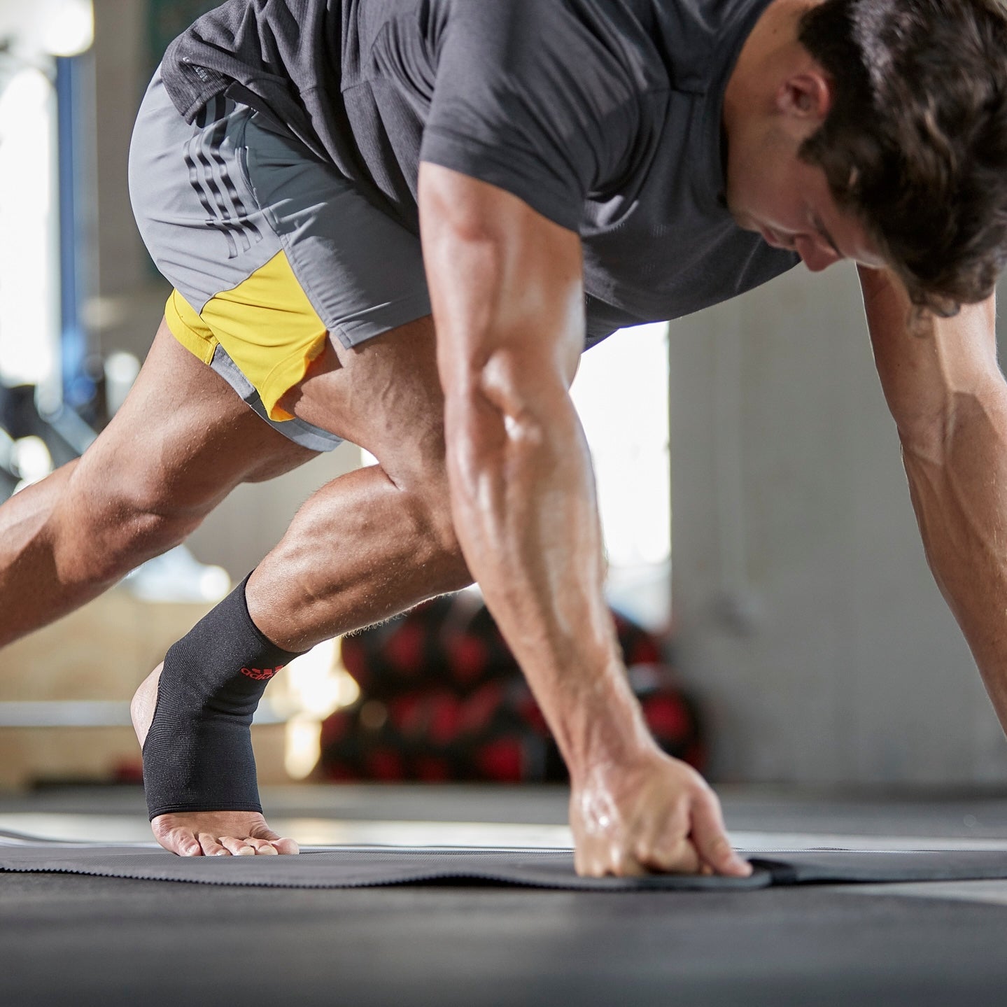 adidas Classic Ankle Support Red on man working out